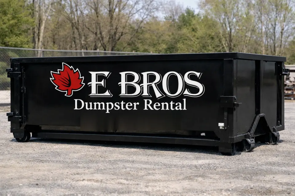 E'Bros 10 yard dumpster with the red maple leaf logo, owner operated dumpster rental in Auburn MA