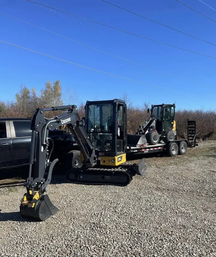 E'Bros mini excavator and skid steer on a trailer for excavation near Auburn, MA