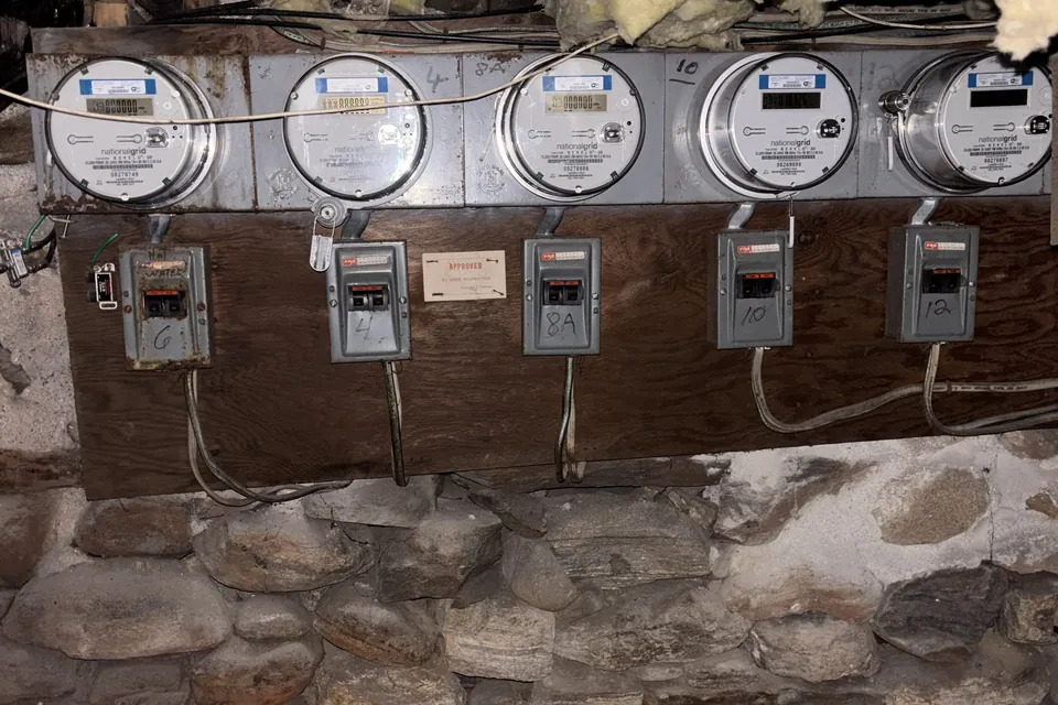 Old apartment meter bank before upgrade by Gourley Electric