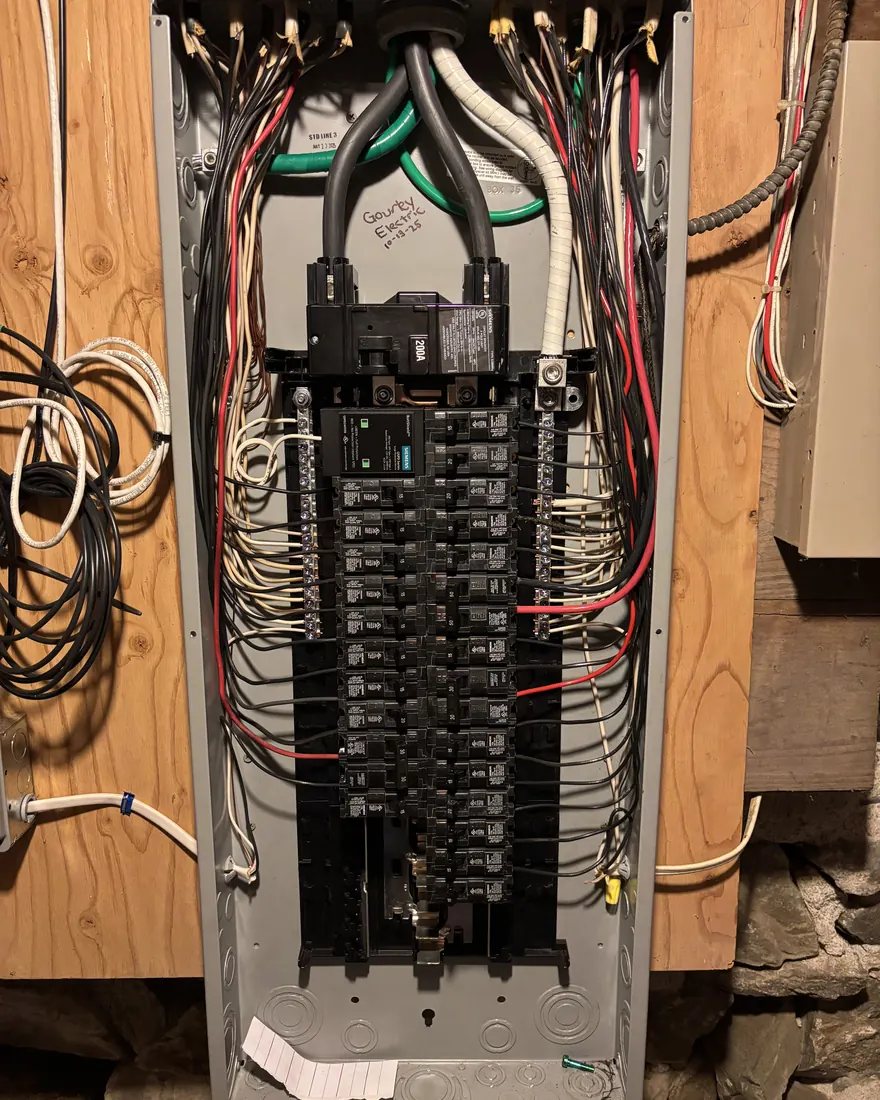 Rebuilt electrical panel with conductors dressed flat and every breaker labeled by Gourley Electric